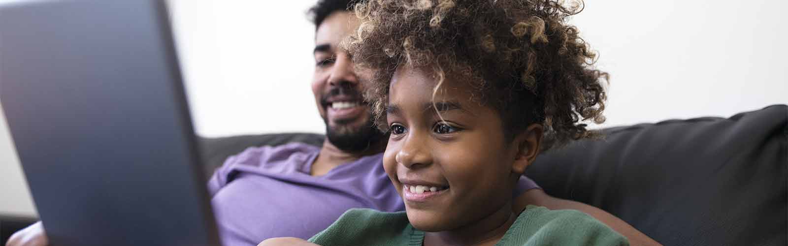 Dad and son watching videos online