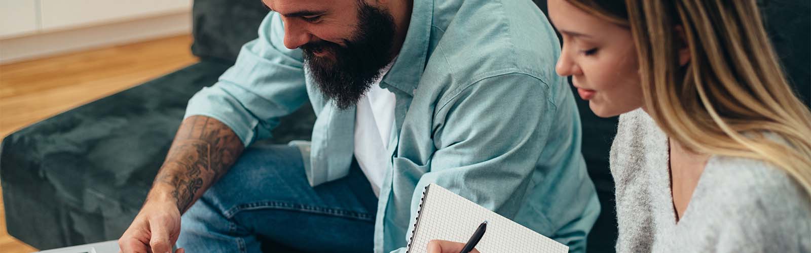 Young couple planning a savings budget