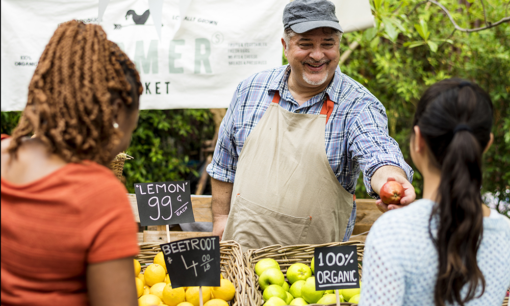 Farmer selling apple at Farmer's Market