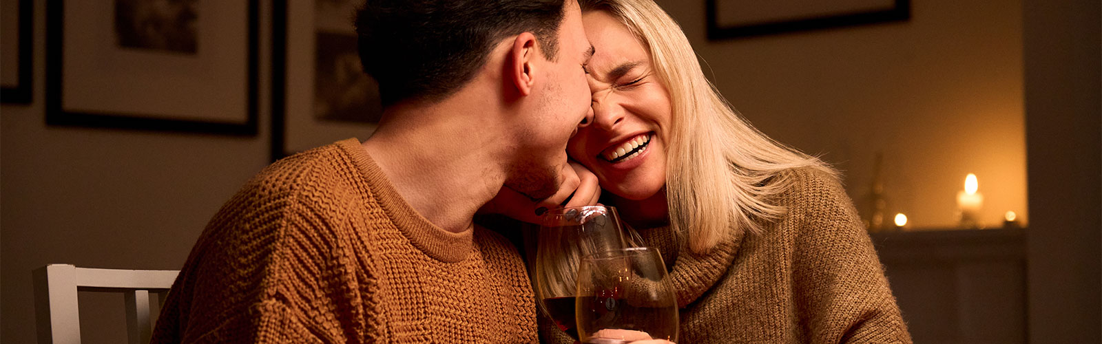 Young couple enjoying dinner at home