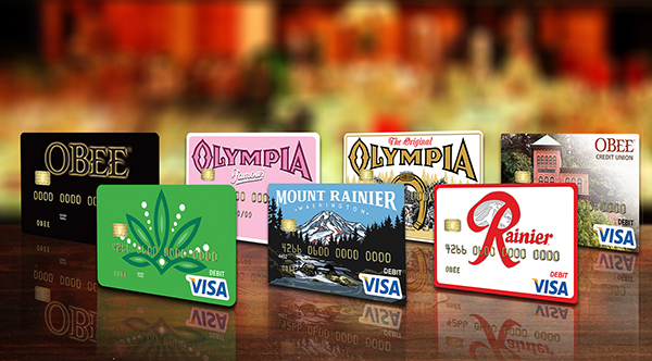 Debit cards with mount rainier washington design, rainier beer logo, pabst blue ribbon logo, olympia brewery logo, lone star beer logo