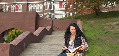 Girl reading about student Loans